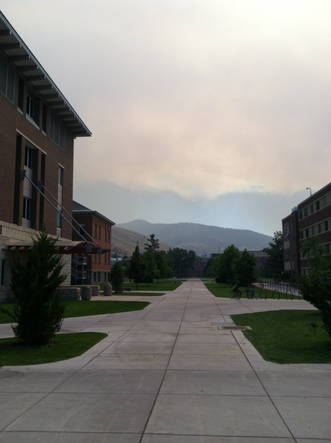 Smoke in the distance blocks the view of the mountains surrounding the valley